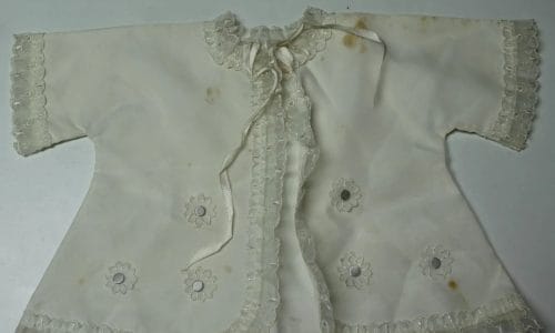 Before-restoration photo: antique garment