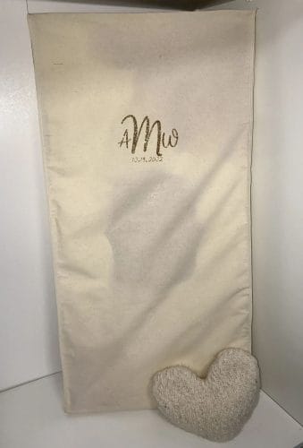 Monogrammed muslin garment bag