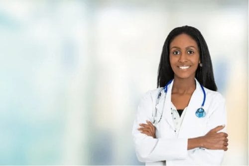 Woman doctor in white coat with stethoscope